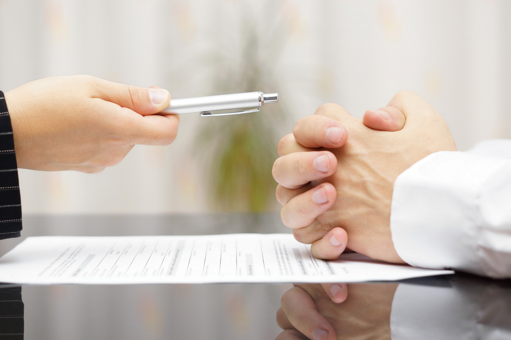 man refusing to sign a document BMO-bank-severance-pay