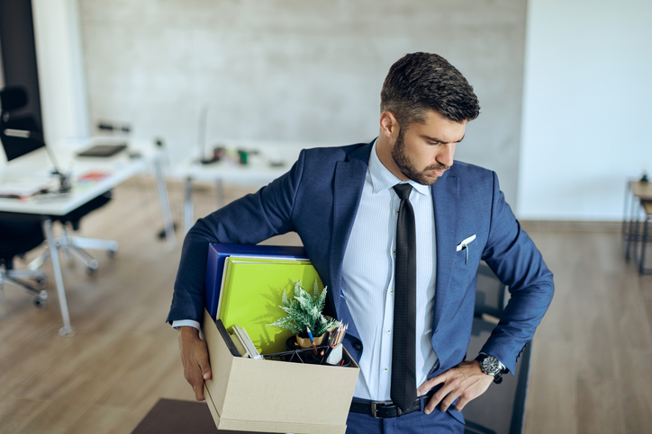 Fired businessman feeling worried about loosing his job. Orosur-Mining-know-your-rights
